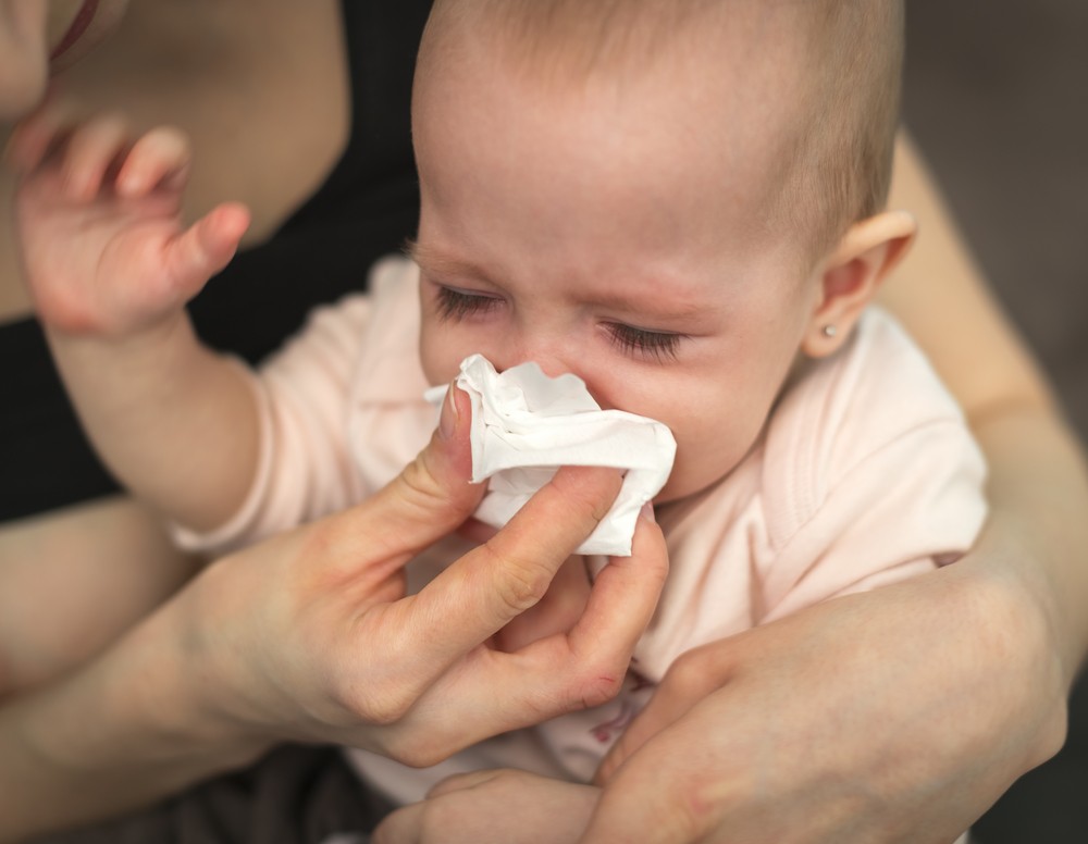 Copilul strănută Curge nasul